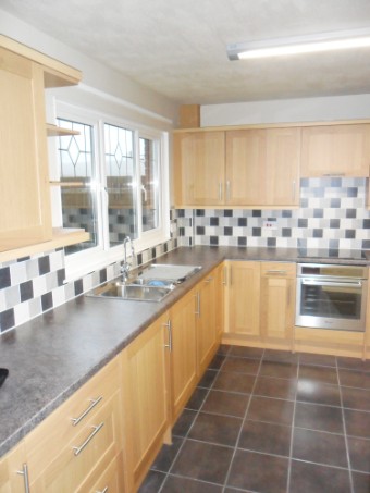 Fiited kitchen, floor and wall tiling